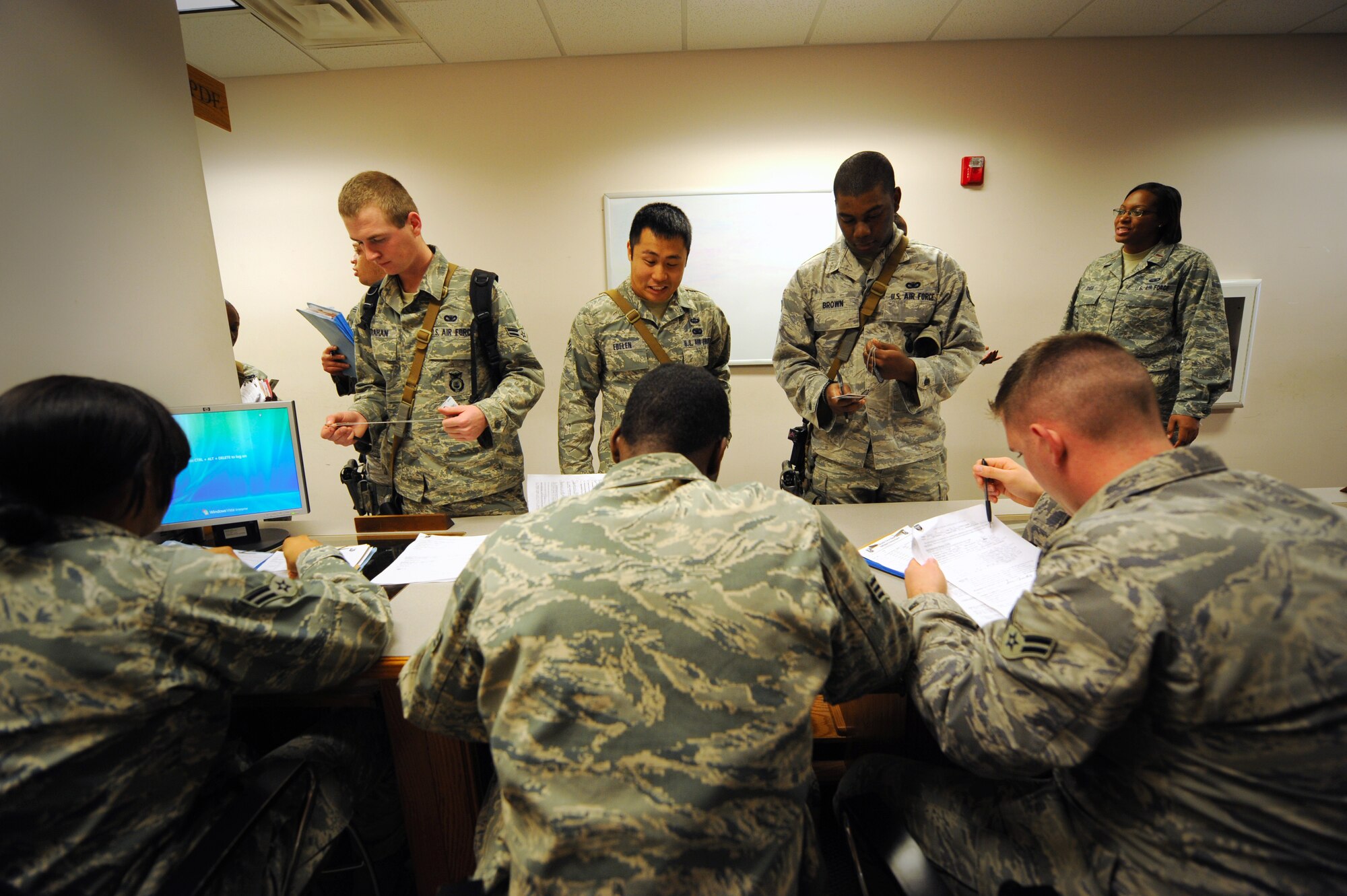 MOODY AIR FORCE BASE, Ga. -- Airmen from several Moody agencies  ensure members of the 823rd Security Forces Squadron are prepared for a deployment here Jan. 20. Approximately 70 Airmen from the 823rd SFS will be providing security at the Toussaint Louverture International Airport in Haiti’s capital, Port-au-Prince. (U.S. Air Force photo by Senior Airman Gina Chiaverotti-Paige)