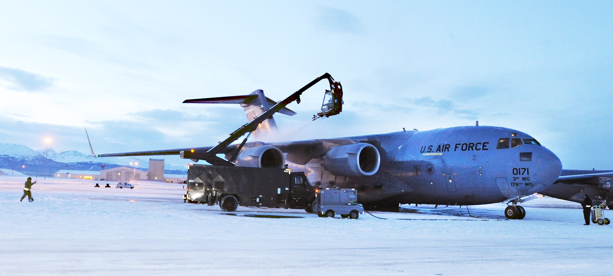 A C-17 Globemaster III is de-iced in preparation for a humanitarian mission to Haiti Jan. 19, 2010, at Elmendorf Air Force Base, Alaska. The 517th Airlift Squadron and the 249th Airlift Squadron is assisting in the aftermath of the earthquake that recently struck the island. (Air Force photo/Airman 1st Class Kristin High)
