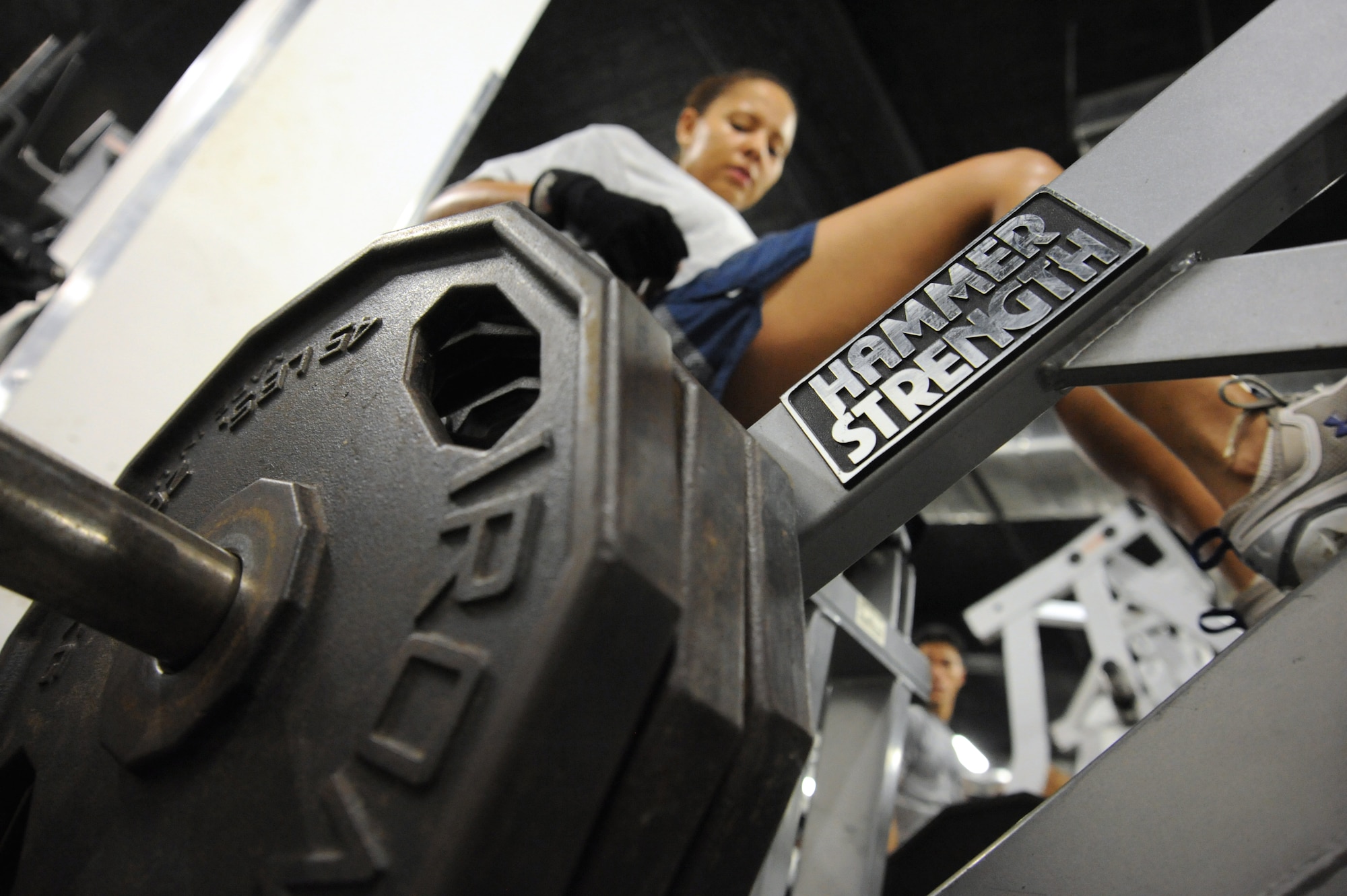Air Force Master Sgt. Theresa Grolla, U.S. Forces Iraq provost marshal office resource manager for Joint Task Force 134, works out in the gym on Camp Victory, Iraq, Jan 19, 2010. Sergeant Grolla placed second in the Paradise Cup Fitness competition in 2008. Sergeant Grolla is deployed from Columbus Air Force Base, Miss. (U.S. Air Force photo/Master Sgt. Trish Bunting/Released)