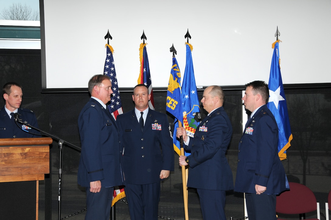 Lt Col. Mark Gebhard of the Civil Engineering Squadron passes the change of command to Col. William Wolfarth during the offical change of command Jan. 9, 2010 at the 178th Fighter Wing in Springfield, Ohio.  Maj Matthew Craig will be the new commander of the CES.