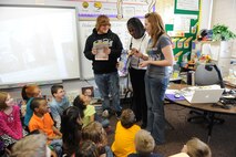 MINOT AIR FORCE BASE, N.D. -- Tommy Bueschell and Culynn Sollaway, both students of retired Minot Airmen, participate in opening a time capsule they put together while they were second graders in Mrs. Joice Griffin’s class at North Plains Elementary School here Jan. 20. (U.S. Air Force photo by Staff Sgt. Stacy Moless)