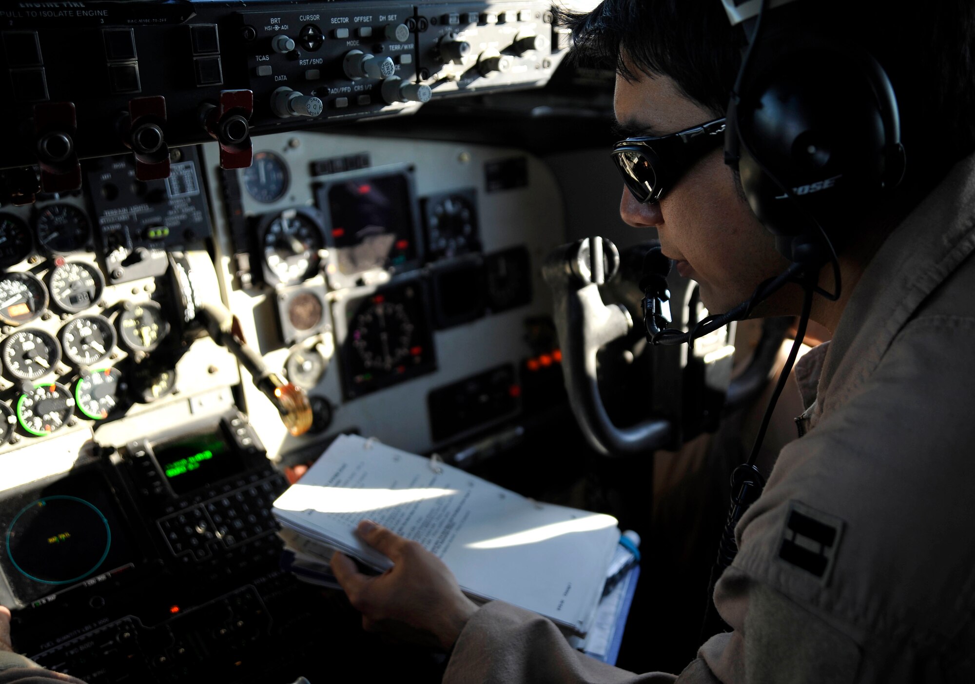 U.S. Air Force Capt.Erik Gorza, 340th Expeditionary Air Refueling Squadron KC-135 Stratotanker co-pilot, completes his checklist before starting engines, Jan.15, 2010, in Southwest Asia.  The KC-135 will be refueling aircraft over Afgahanistan to support Operation Enduring Freedom. (U.S. Air Force photo/ SSgt Angelita Lawrence/released)
