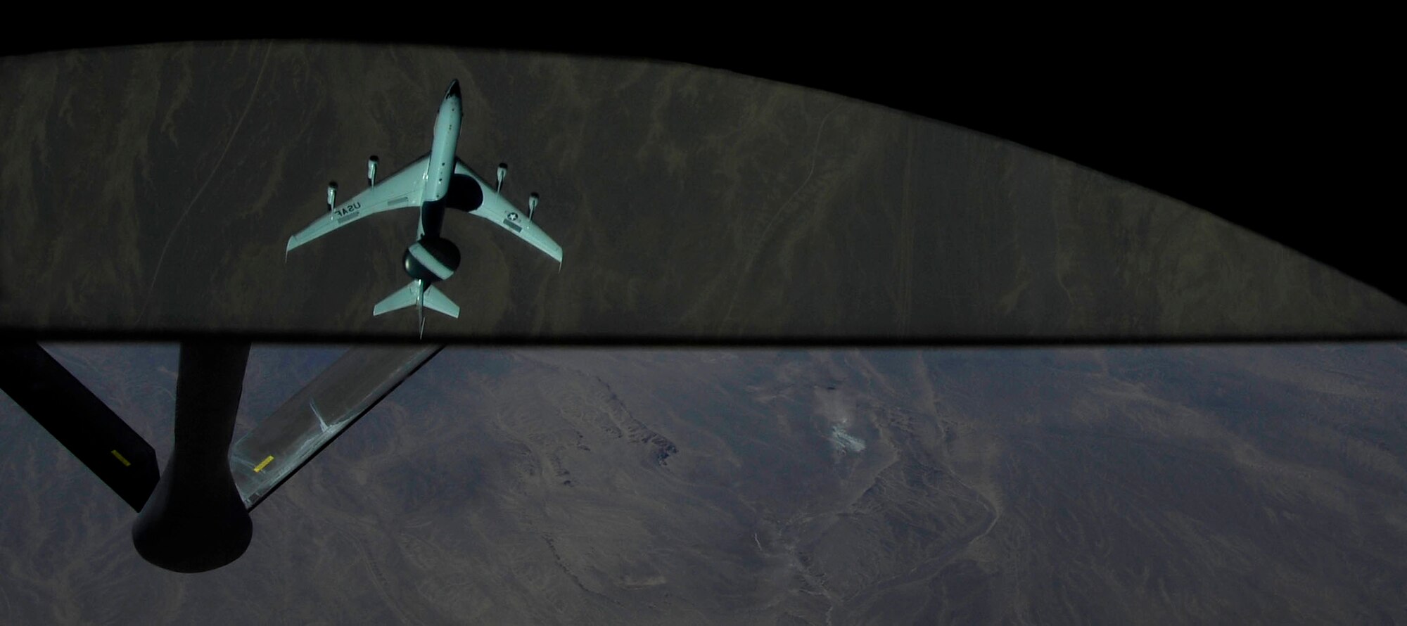 U.S. Air Force Airmen from the 340th Expeditionary Air Refueling Squadron,  refuel an E-3 Sentry, Airborne Warning and Control System (AWACS) aircraft, Jan.15, 2010, over Afghanistan.  The AWACS is an airborne radar system designed to detect and manage aircraft. The weapon system is used at high altitude and can distinguish between friendly and hostile aircraft from hundreds miles away. (U.S. Air Force photo/ SSgt Angelita Lawrence/released)