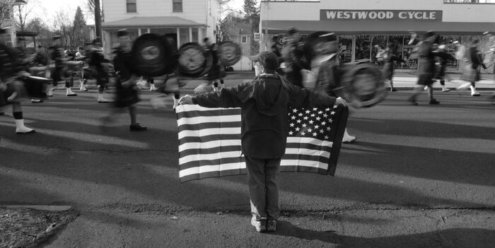 WESTWOOD, N.J. - People line the street to honor a local Marine killed in Afghanistan, Jan. 21. The body of Sgt. Christopher R. Hrbek, 25, a Westwood, N.J., native, was escorted from Dover Air Force Base, Del., past streets lined with people waving American Flags to Beckers Funeral Home. Hrbek, a field artillery cannoneer with 3rd Battalion, 10th Marine Regiment, Regimental Combat Team 7, II Marine Expeditionary Force, died Jan. 14 while conducting combat operations in Helmand Province, Afghanistan. The Bronze Star Medal with combat distinguishing device is scheduled to be presented to his family at his funeral, Jan. 23.  The medal was approved for saving the life of his battalion sergeant major after an improvised explosive device severed both his legs during a firefight, Dec. 23, 2009. (Official Marine Corps photo by Sgt. Randall A. Clinton)
