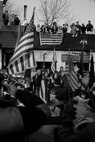 WESTWOOD, N.J. - People line the street to honor a local Marine killed in Afghanistan, Jan. 21. The body of Sgt. Christopher R. Hrbek, 25, a Westwood, N.J., native, was escorted from Dover Air Force Base, Del., past streets lined with people waving American Flags to Beckers Funeral Home. Hrbek, a field artillery cannoneer with 3rd Battalion, 10th Marine Regiment, Regimental Combat Team 7, II Marine Expeditionary Force, died Jan. 14 while conducting combat operations in Helmand Province, Afghanistan. The Bronze Star Medal with combat distinguishing device is scheduled to be presented to his family at his funeral, Jan. 23. The medal was approved for saving the life of his battalion sergeant major after an improvised explosive device severed both his legs during a firefight, Dec. 23, 2009. (Official Marine Corps photo by Sgt. Randall A. Clinton)