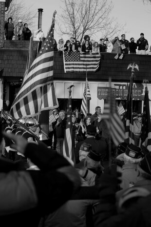 WESTWOOD, N.J. - People line the street to honor a local Marine killed in Afghanistan, Jan. 21. The body of Sgt. Christopher R. Hrbek, 25, a Westwood, N.J., native, was escorted from Dover Air Force Base, Del., past streets lined with people waving American Flags to Beckers Funeral Home. Hrbek, a field artillery cannoneer with 3rd Battalion, 10th Marine Regiment, Regimental Combat Team 7, II Marine Expeditionary Force, died Jan. 14 while conducting combat operations in Helmand Province, Afghanistan. The Bronze Star Medal with combat distinguishing device is scheduled to be presented to his family at his funeral, Jan. 23. The medal was approved for saving the life of his battalion sergeant major after an improvised explosive device severed both his legs during a firefight, Dec. 23, 2009. (Official Marine Corps photo by Sgt. Randall A. Clinton)