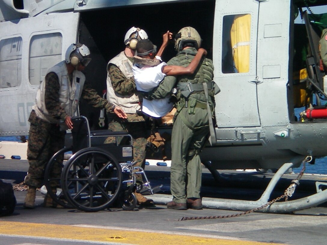 HMLA-467 Marines providing assistants to the citizens of Haiti.