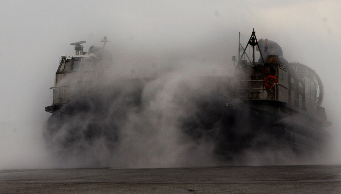 A landing craft air cushion (LCAC), from Assault Craft Unit-1 (ACU-1), lands ashore to support the embarkation of the 31st Marine Expeditionary Unit (MEU) onto the ships of the forward-deployed Essex Amphibious Ready Group (ARG). The LCACs were used to expedite the  loading of more than 170 vehicles and 450 tons onto the forward-deployed amphibious assault ship USS Essex (LHD 2), the forward-deployed transport dock ship USS Denver (LPD 9) and the forward-deployed dock landing ship USS Harpers Ferry (LSD 49). The MEU is scheduled to support Exercise Cobra Gold 2010 (CG ’10) as part of the Spring Patrol. CG’ 10 is a regularly scheduled joint and coalition multinational exercise hosted annually by the Kingdom of Thailand.