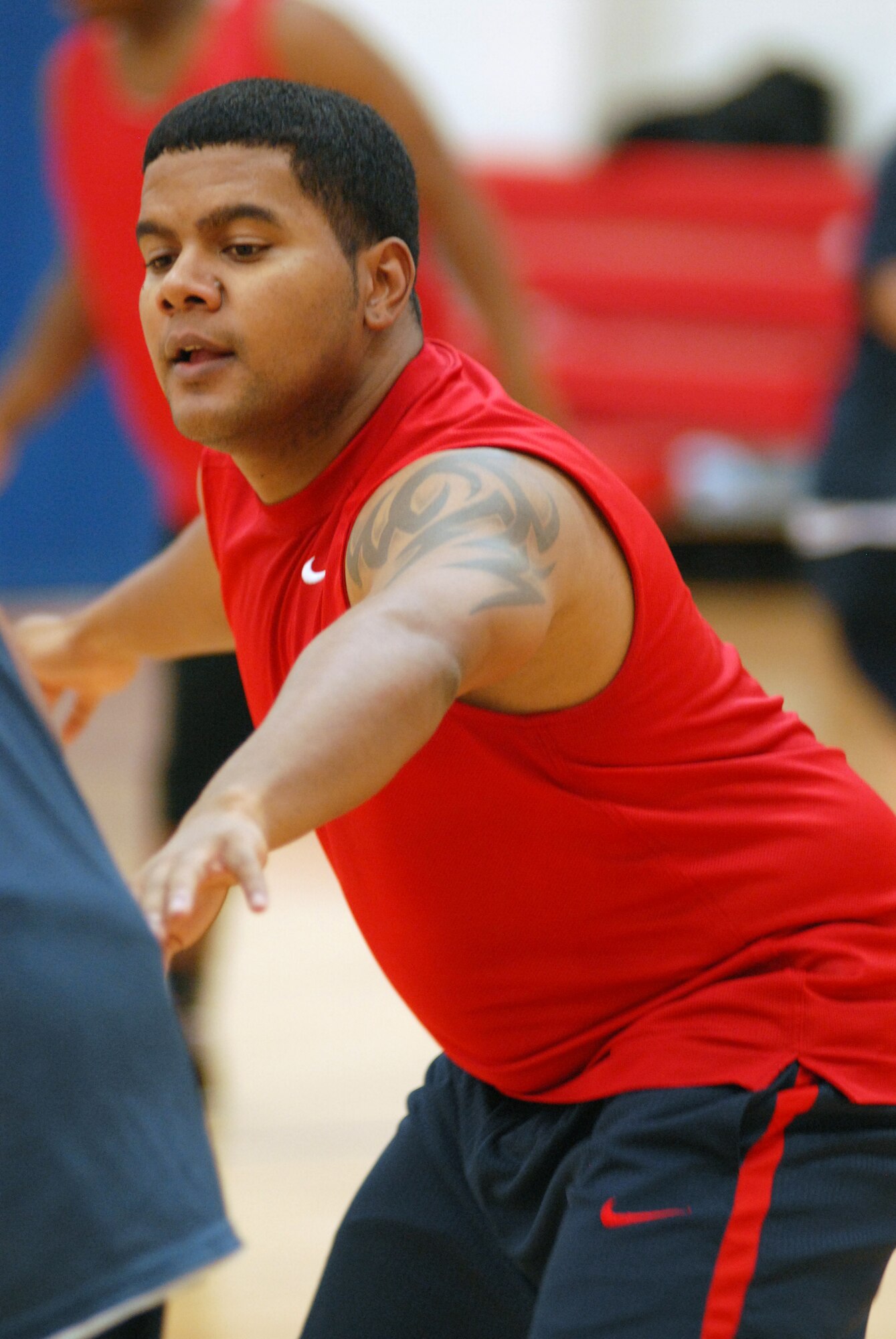 VANDENBERG AIR FORCE BASE, Calif. -- Trying to block-out his opponent, Daniel Castillo, of the 30th Security Forces Squadron team, effectively stopped a pass made from the Lady Hawks team here Thursday, Jan. 21, 2010. The game came to a close as the 30th Security Forces Squadron team beat the Lady Hawks 105-25.(U.S. Air Force photo/ Airman 1st Class Angelina Drake)



