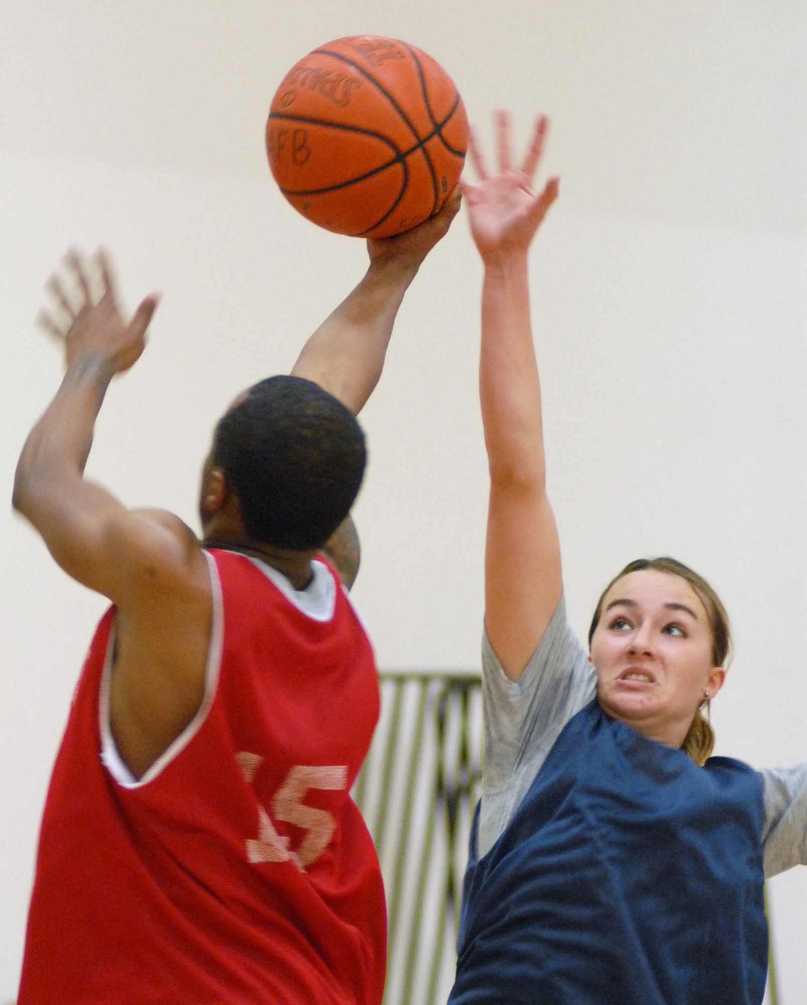 VANDENBERG AIR FORCE BASE, Calif.-- Defending from inside the paint, Jessica Stewart, of the 392 Training Squadron, keeps the 30th Security Forces Squadron team at bay giving her team mates a chance to score here Thursday, Jan. 21, 2010. The game came to a close as the 30th Security Forces Squadron team beat the Lady Hawks 105-25.(U.S. Air Force photo/ Airman 1st Class Angelina Drake)

