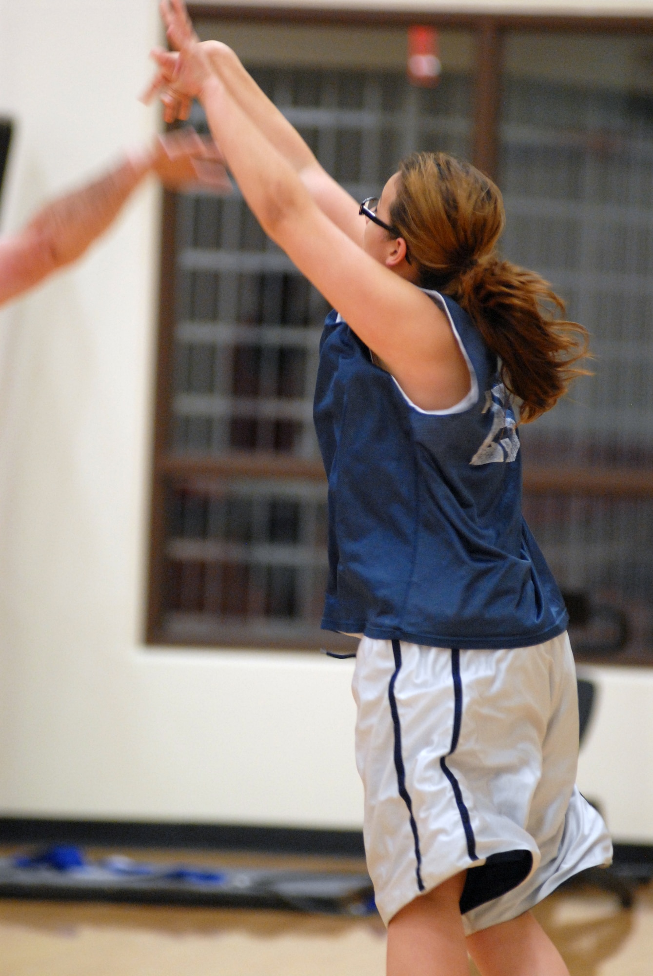 VANDENBERG AIR FORCE BASE, Calif. -- Making the first three-pointer for the Lady Hawks team, Shanda Nepomuceno, playing for the Lady Hawks, scores from the corner of the court here Thursday, Jan. 21, 2010. The game came to a close as the 30th Security Forces Squadron team beat the Lady Hawks 105-25.(U.S. Air Force photo/ Airman 1st Class Angelina Drake)


