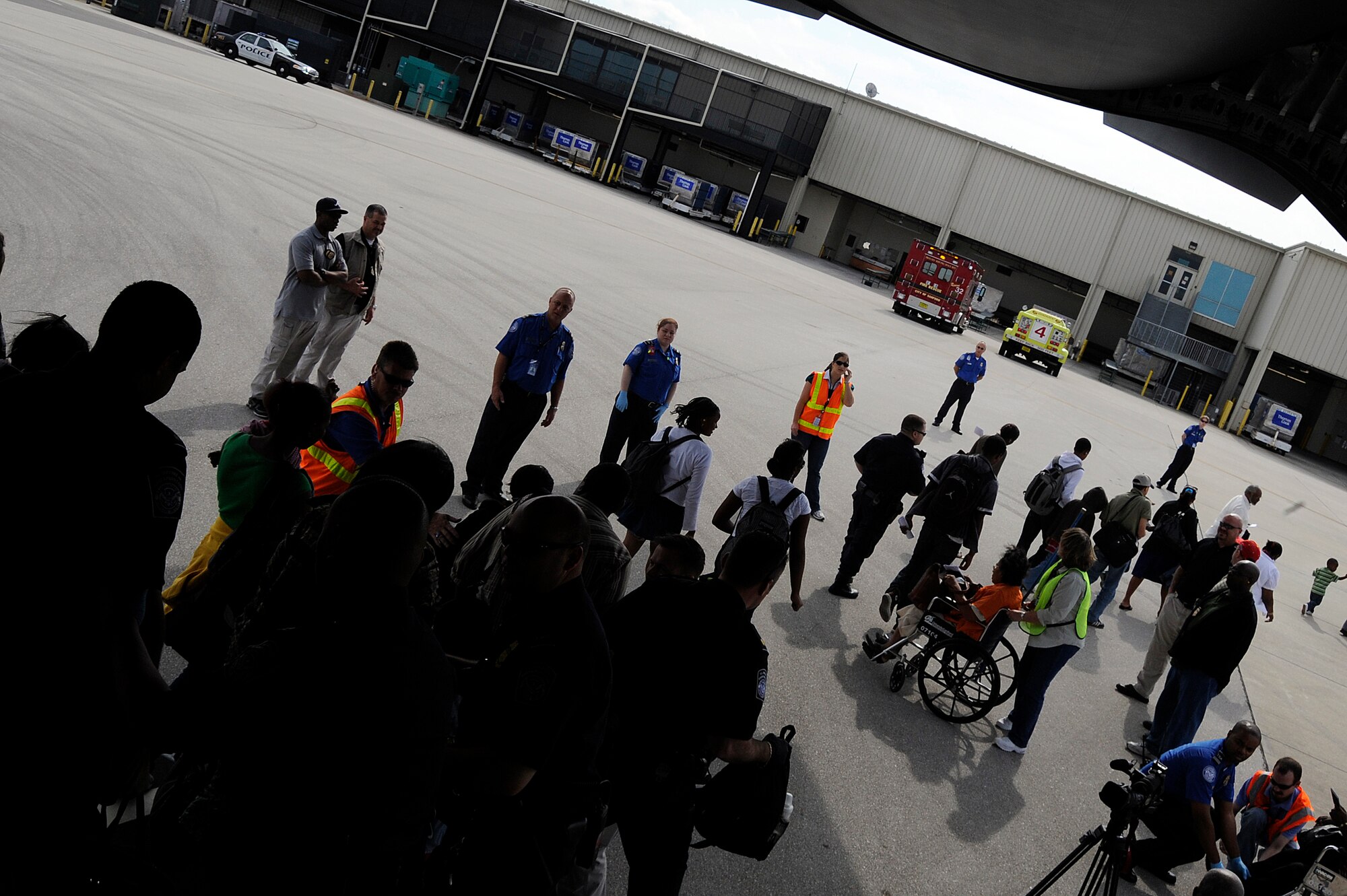 Evacuees from Haiti are helped off a C-17 Globemaster III at Orlando Sanford International Airport Jan. 21. The C-17 carried more than 100 evacuees from Haiti after an earthquake hit the country Jan. 12. The evacuees consisted of both American and Haitian citizens.
(U.S. Air Force photo by Staff Sgt. Joseph L. Swafford Jr./Released)
