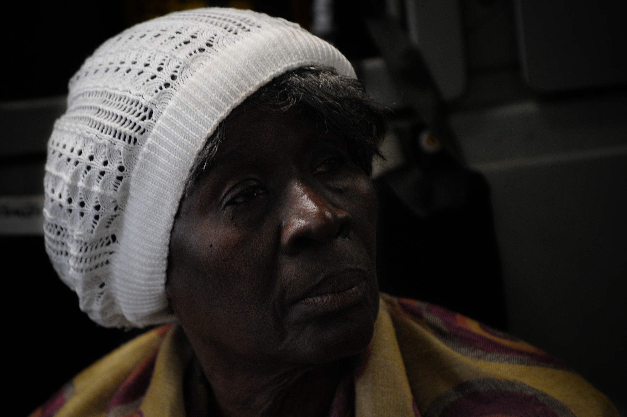 An evacuee from Haiti waits to leave a C-17 aircraft at Orlando Sanford International Airport Jan. 21. The C-17 carried more than 100 evacuees from Haiti after the country was hit by an earthquake Jan. 12. The evacuees consisted of  both American and Haitian citizens.

(U.S. Air Force photo by Staff Sgt. Joseph L. Swafford Jr./Released)
