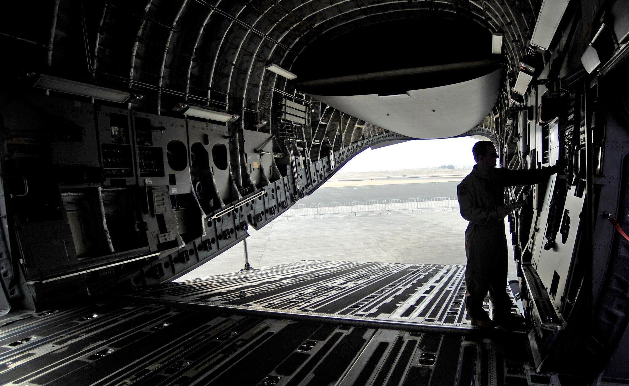 Staff Sgt. Ken Travis troubleshoots a hydraulic system on a C-17 Globemaster III, Jan. 20, 2010, during the Bahrain International Airshow. Sergeant Travis is a flying crew chief with the 437th Aircraft Maintenance Squadron. (U.S. Air Force photo/Staff Sgt. Angelita Lawrence)


