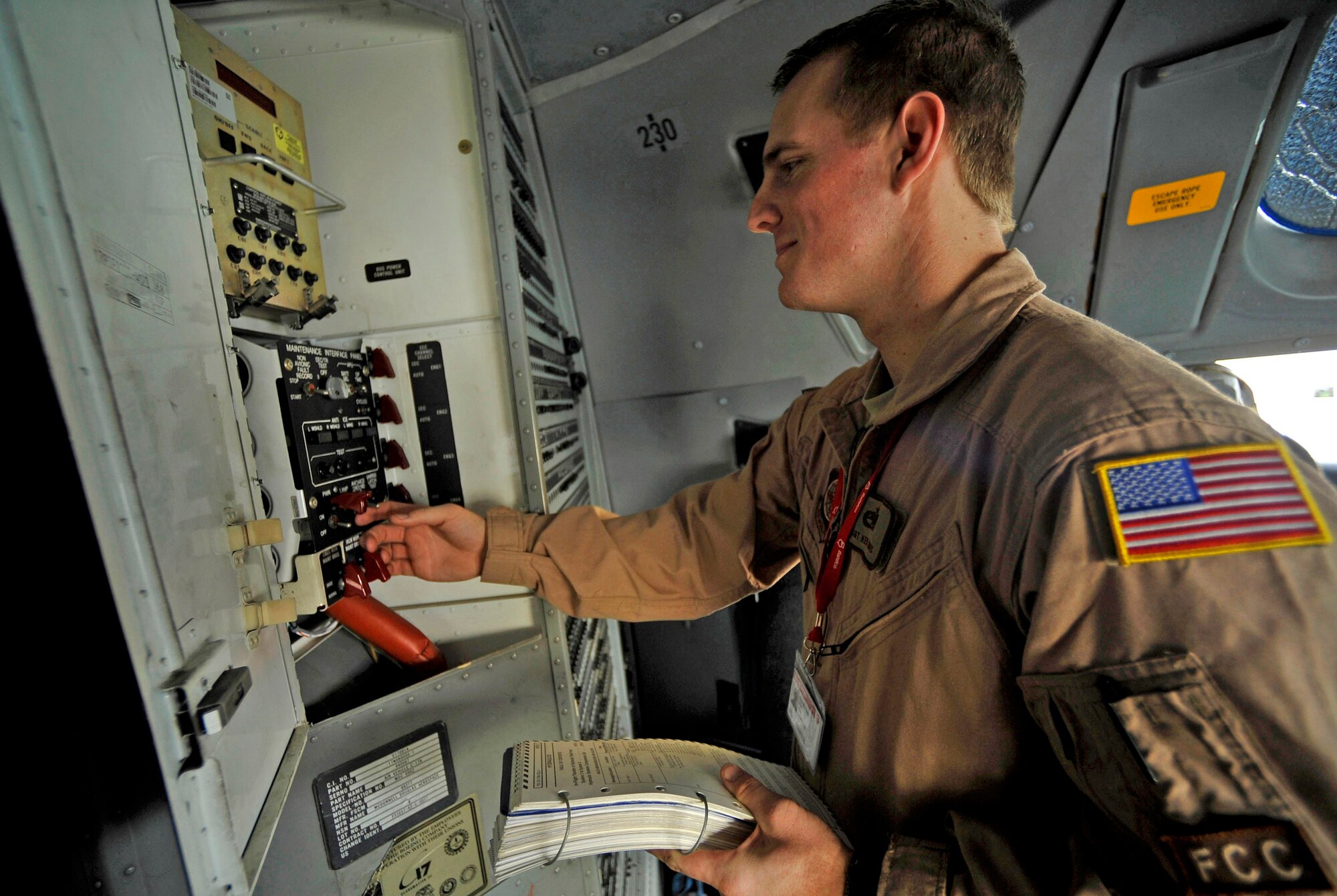 Staff Sgt. Ken Travis troubleshoots a communication system on a C-17 Globemaster III, Jan. 22, 2010, during the Bahrain International Airshow. Sergeant Travis is a flying crew chief with the 437th Aircraft Maintenance Squadron. (U.S. Air Force photo/ Staff Sgt. Angelita Lawrence) 
