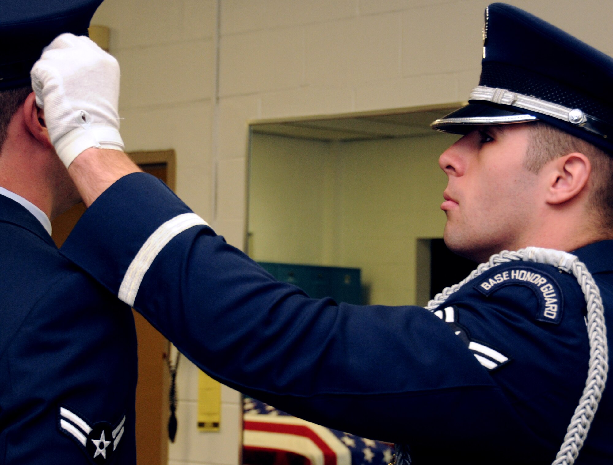 EGLIN AIR FORCE BASE, Fla. – Airman 1st Class Joshua Titus, Honor Guard, inspects Airman 1st Class Christopher Hern’s uniform before beginning practice drills, Jan. 20. “Working in a support role Airmen can lose their sense of perspective as to why they serve,” said Senior Master Sgt. Thomas Walker, 96th Air Base Wing, on what it means to serve in the honor guard.  “Being able to step outside the career field and daily, mundane taskings and serve a higher purpose gives them a greater sense of duty, commitment and perspective that pays huge dividends when they return to their normal job.  Ask any Airmen who has ever served in the Honor Guard and they will tell you it was one of the greatest experiences of their career (whether they were volunteers or volun"tolds").  The sense of fulfillment, job satisfaction and pride are unmatched.”   The next honor guard rotation begins Feb. 1 through July 31.  Deadline to sign-up is Jan. 25.  To get involved and volunteer contact your first sergeant or chief. (U.S. Air Force photo/ Airman 1st Class Anthony Jennings)
