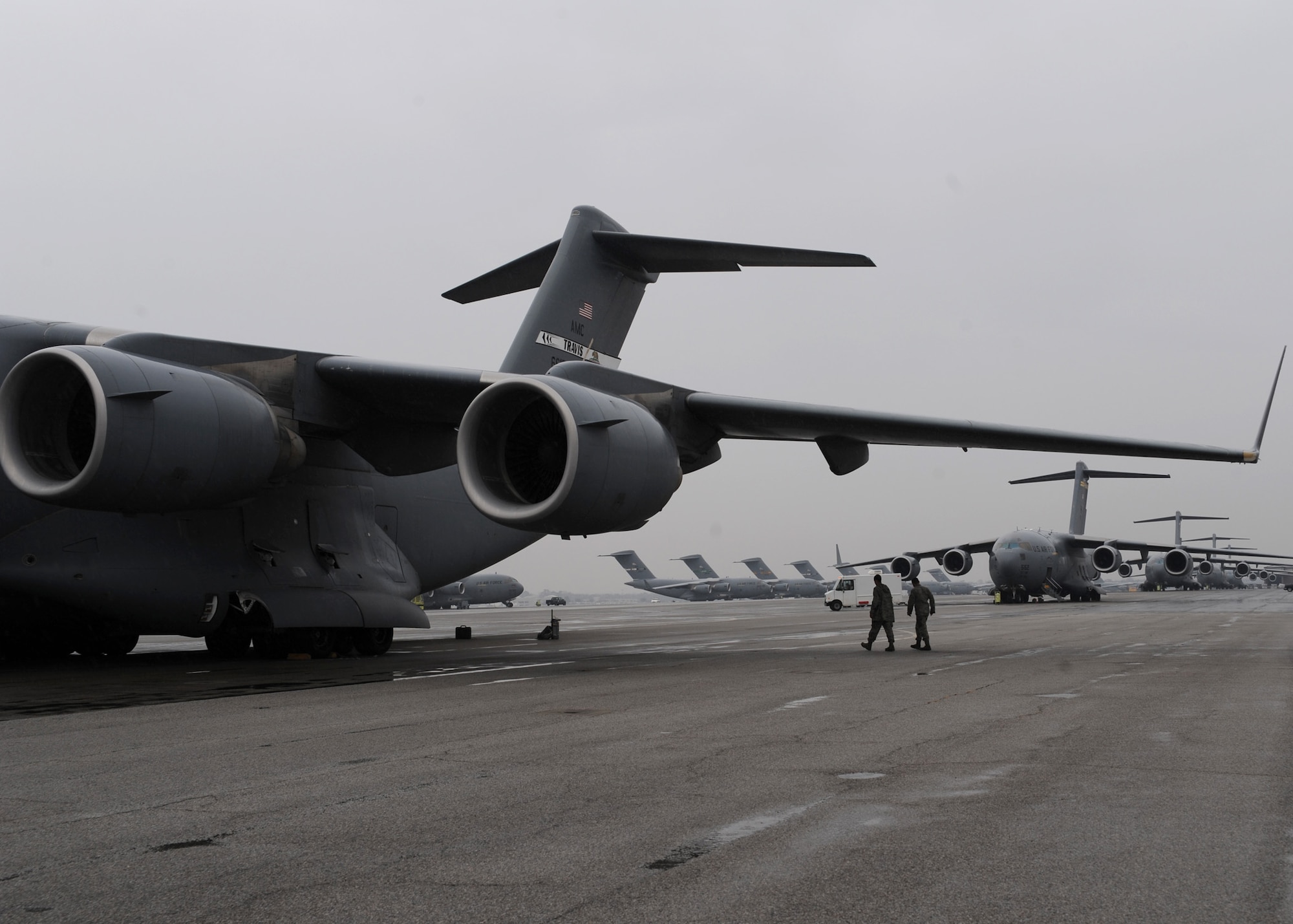 A C-17 from Travis AFB, Calif., sits on the Charleston AFB flightline here along with planes from several other bases, Jan. 21. The planes are being used to support the humanitarian relief effort in Haiti. The Air Force's airlift capability enables the U.S. to respond immediately to any disaster domestically or worldwide. the U.S. is the only country with an aircraft fleet capable of providing this type of response.   (U.S. Air Force photo/Senior Airman Katie Gieratz)(RELEASED)
