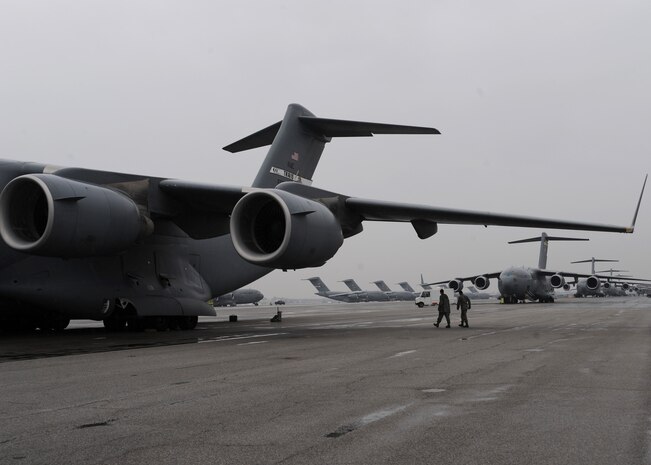 A C-17 from Travis AFB, Calif., sits on the Charleston AFB flightline here along with planes from several other bases, Jan. 21. The planes are being used to support the humanitarian relief effort in Haiti. The Air Force's airlift capability enables the U.S. to respond immediately to any disaster domestically or worldwide. the U.S. is the only country with an aircraft fleet capable of providing this type of response.   (U.S. Air Force photo/Senior Airman Katie Gieratz)(RELEASED)