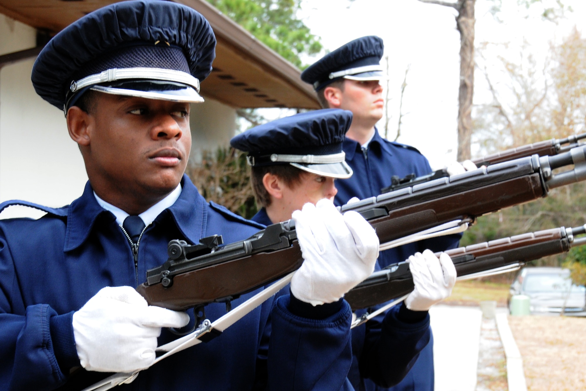 EGLIN AIR FORCE BASE, Fla. – Senior Airman Michael Gray, Airman 1st Class Krystle Orth and Kurtis Clayton, Honor Guard, practice the 21 Gun Salute Jan. 20. “Working in a support role Airmen can lose their sense of perspective as to why they serve,” said Senior Master Sgt. Thomas Walker, 96th Air Base Wing, on what it means to serve in the honor guard.  “Being able to step outside the career field and daily, mundane taskings and serve a higher purpose gives them a greater sense of duty, commitment and perspective that pays huge dividends when they return to their normal job.  Ask any Airmen who has ever served in the Honor Guard and they will tell you it was one of the greatest experiences of their career (whether they were volunteers or volun"tolds").  The sense of fulfillment, job satisfaction and pride are unmatched.”   The next honor guard rotation begins Feb. 1 through July 31.  Deadline to sign-up is Jan. 25.  To get involved and volunteer contact your first sergeant or chief. (U.S. Air Force photo/ Airman 1st Class Anthony Jennings)