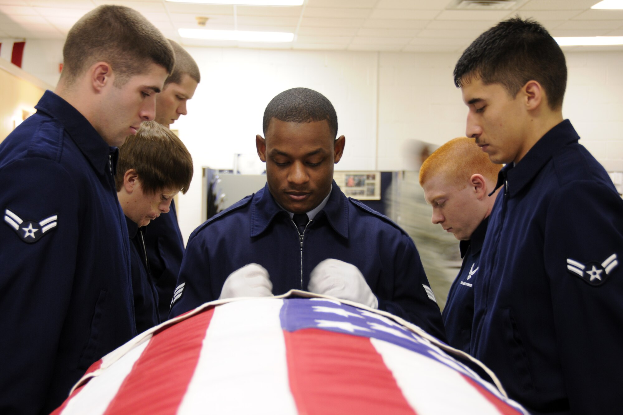 EGLIN AIR FORCE BASE, Fla. – Senior Airman Michael Gray (center), Airman 1st Class Joshua Titus, Krystle Orth, Christopher Hern (left), Eric Epifanio and Kurtis Clayton, Honor Guard, practice movements for military funerals, Jan. 20. “Working in a support role Airmen can lose their sense of perspective as to why they serve,” said Senior Master Sgt. Thomas Walker, 96th Air Base Wing, on what it means to serve in the honor guard.  “Being able to step outside the career field and daily, mundane taskings and serve a higher purpose gives them a greater sense of duty, commitment and perspective that pays huge dividends when they return to their normal job.  Ask any Airmen who has ever served in the Honor Guard and they will tell you it was one of the greatest experiences of their career (whether they were volunteers or volun"tolds").  The sense of fulfillment, job satisfaction and pride are unmatched.”   The next honor guard rotation begins Feb. 1 through July 31.  Deadline to sign-up is Jan. 25.  To get involved and volunteer contact your first sergeant or chief. (U.S. Air Force photo/ Airman 1st Class Anthony Jennings)