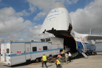 A Federal Aviation Administration (FAA) mobile air traffic control tower is being loaded on to a Russian owned Antonov An-124 aircraft bound for the Port Au Prince Airport. The tower will serve as the main tower for the airport. Reservists from the 914th Maintenance Squadrom, Niagra Falls, N.Y. and the 73rd Aerial Port Squadron assist with the approach shoring. (Air Force photo/Master Sgt. Chance Babin)