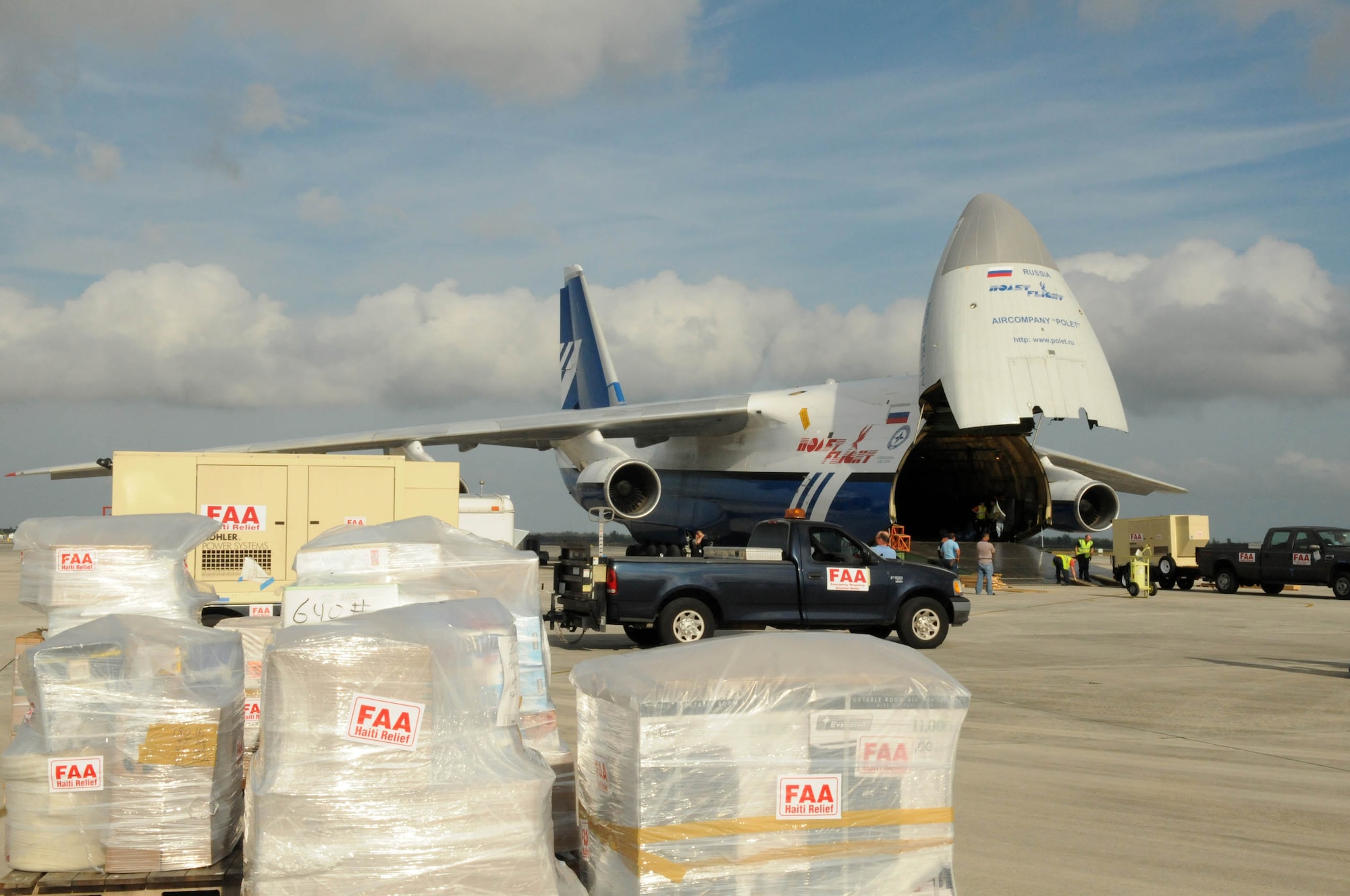 The Federal Aviation Administration load the mobile air traffic control tower, generators, food, clothing, and water aboard an Antonov An-124 en route to Haiti. The tower will be used to help improve proficiency of aircraft flying in and out of Haiti. The supplies will be used to support Operation Unified Response. (U.S. Air Force photo/Master Sgt. Sabrina Johnson)