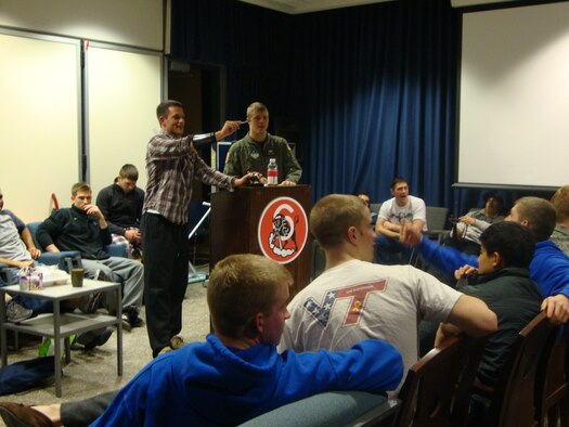 Members of Cadet Squadron 06 hold an auction Jan. 19, 2010, to raise money for Haiti relief efforts. The auction raised more than $2,000, which the squadron will donate to a Combined Federal Campaign-approved relief fund. (U.S. Air Force photo)