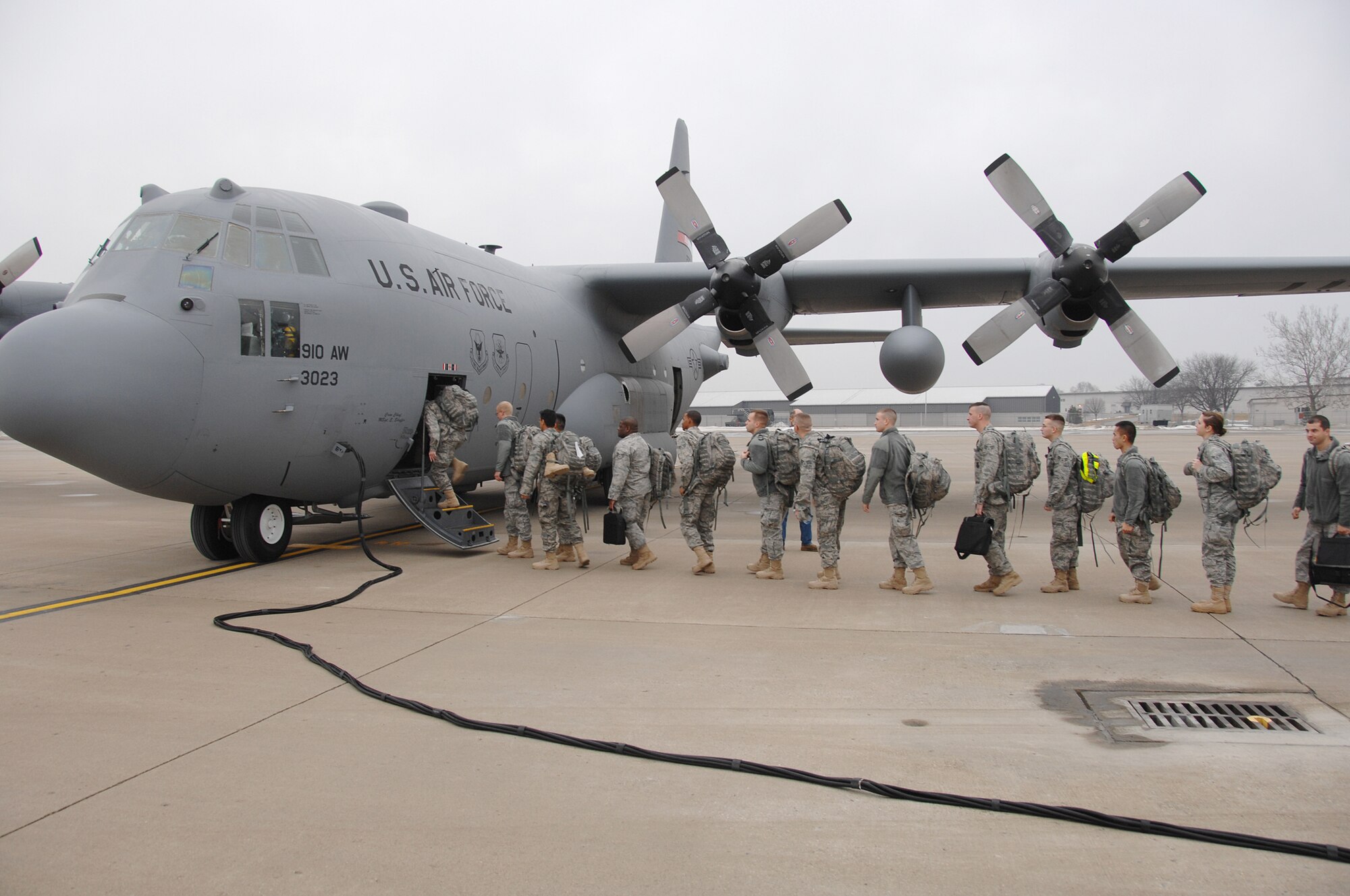 Approximately Twenty-five 88th Security Force Squadron members board a C-130 from Youngstown for a flight to the east coast to catch another aircraft for the overseas flight to Southwest Asia. (U.S. Air Force photos by Ben Stasser)