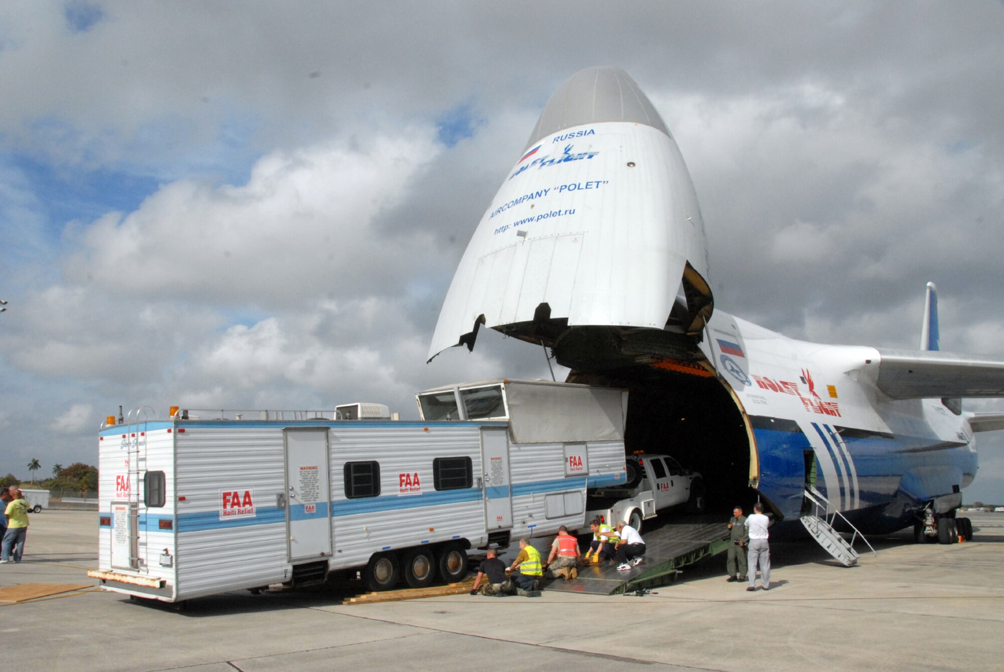 A mobile air traffic control tower is loaded onto a Russian Antonov An-124 cargo plane at Homestead Air Reserve Base, Fla., Jan. 21, 2010. The mobile air traffic control tower will increase the efficiency of aid being delivered to earthquake victims in Haiti. (U.S. Air Force photo/Tech. Sgt. Brian Bahret) 
