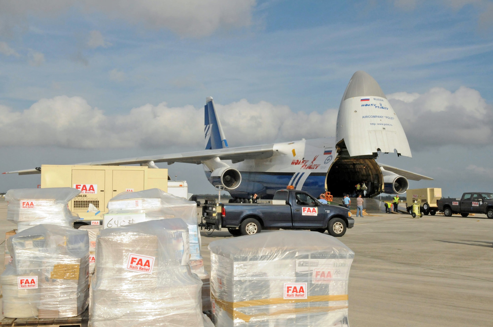Members of the Federal Aviation Administration load a mobile air traffic control tower, generators, food, clothing and water aboard a Russian Antonov An-124 cargo plane en route to Haiti. The tower will be used to help improve the efficiency of aircraft flying in and out of Haiti. The supplies will be used to support Operation Unified Response. (U.S. Air Force photo/Master Sgt. Sabrina Johnson) 