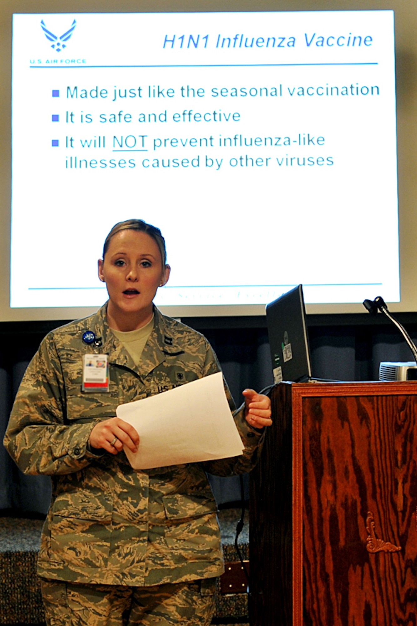 OFFUTT AIR FORCE BASE, Neb. - Capt. Marcie Lewis,  with the 55th Medical Support Squadron, briefs members of Team Offutt about the H1N1 vaccine during a Point of Distribution exercise Jan. 21 at the community center here. More than 1,000 active-duty personnel processed through the center to test the 55th Wing's ability to respond to a public health emergency.  Many received their H1N1 inoculation during the event. U.S. Air Force photo by Charles Haymond
