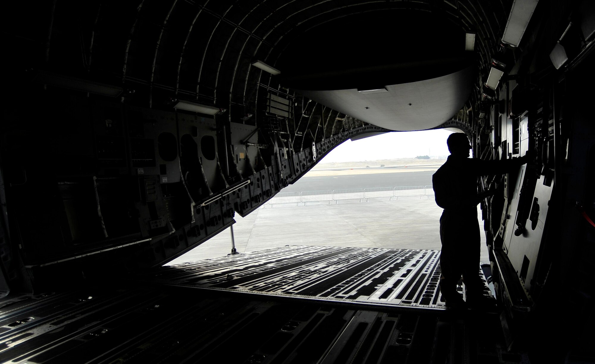U.S. Air Force Staff Sgt. Ken Travis, 437th  Aircraft Maintenance Squadron flying crew chief, troubleshoots a hydraulic system on a C-17 Globemaster III, during the Bahrain International Airshow, Jan. 22, 2010. Sergeant Travis is staioned at Charleston Air Force Base, S.C. (U.S. Air Force photo/Staff Sgt. Angelita Lawrence/released)

