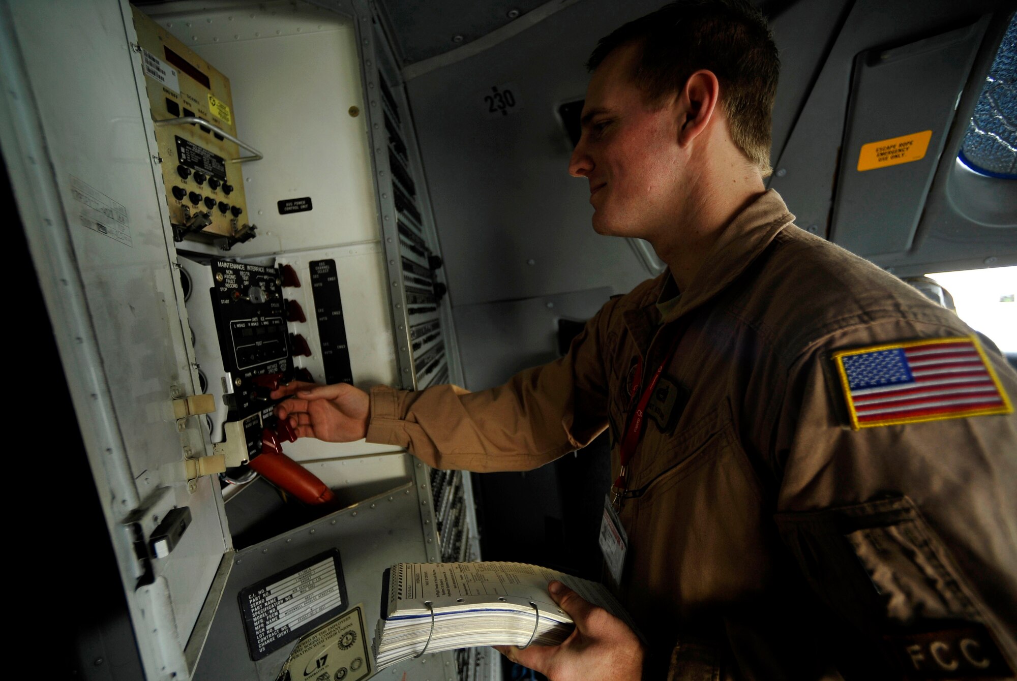 U.S. Air Force Staff Sgt. Ken Travis, a flying crew chief with the 437th Aircraft Maintenance Squadron at Charleston Air Force Base, S.C., troubleshoots a communication system on a C-17 Globemaster III during the Bahrain International Airshow, Jan. 22, 2010. (U.S. Air Force photo/ Staff Sgt. Angelita Lawrence/released)
