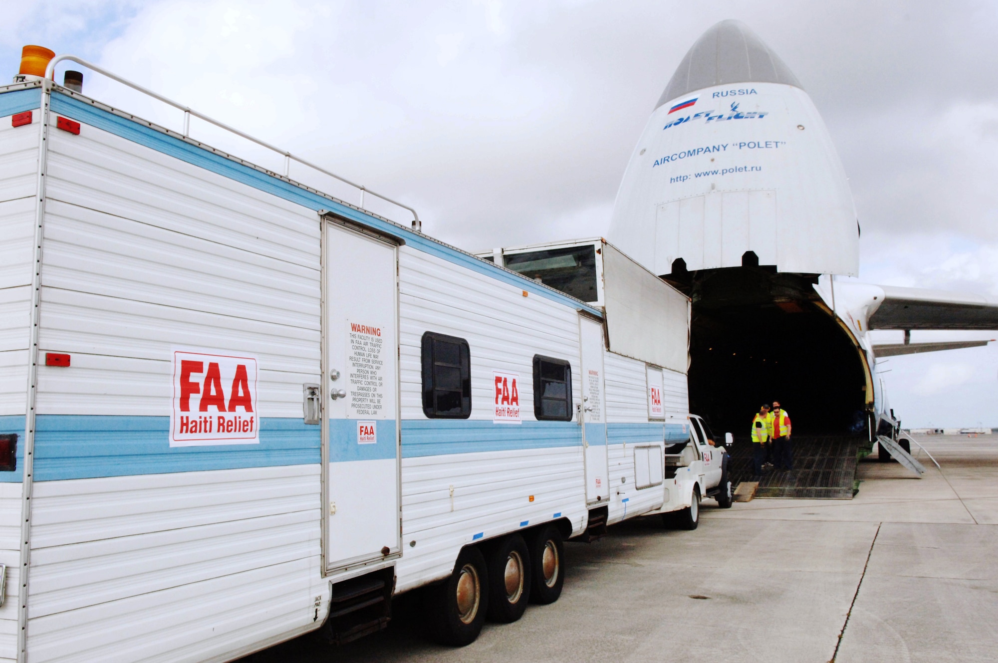 A mobile air traffic control tower is loaded onto a Russian Antonov An-124 cargo plane at Homestead Air Reserve Base, Fla., Jan. 21, 2010.  The mobile air traffic control tower will increase the efficiency of aid being delivered to earthquake victims in Haiti. (U.S. Air Force photo/Tech Sgt Andy Bellamy)