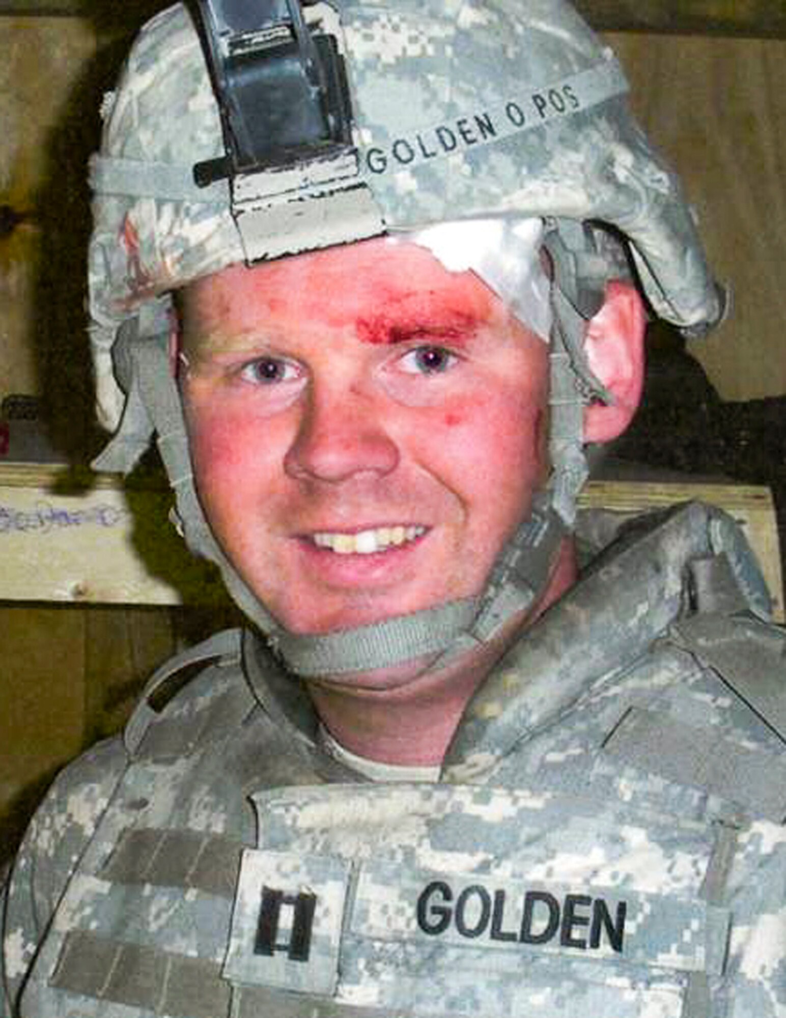 Still bloodied and bandaged, Capt. David Golden was able to return to duty the next day after an enemy 107 mm rocket exploded 8 feet from him at Zerok, Afghanistan, Sept. 28, 2008. 
(Courtesy Photo)