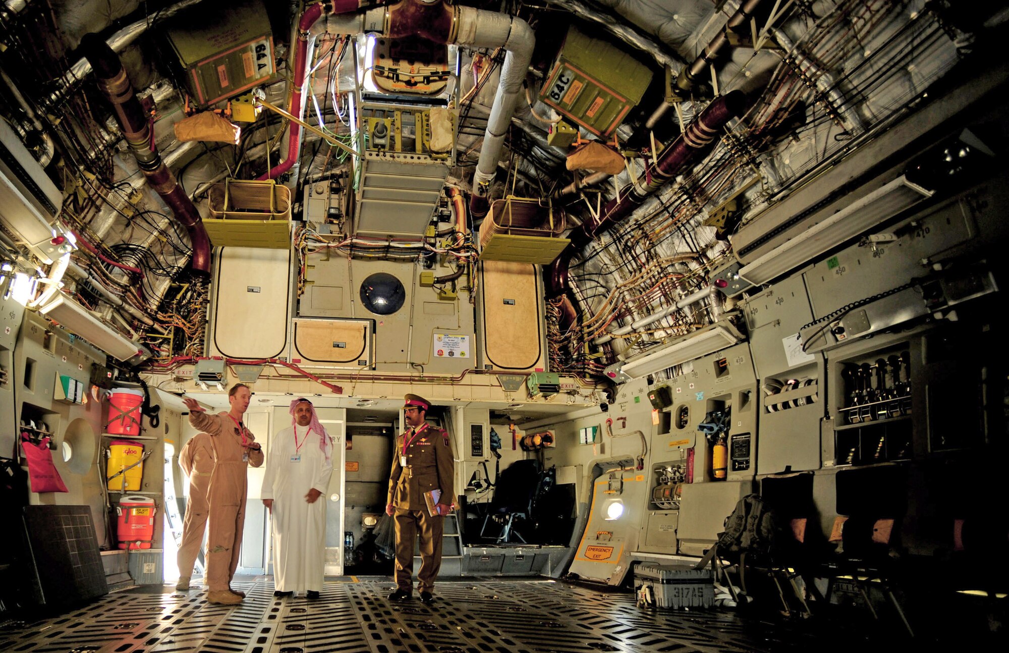 Maj. Edward Taillon explains the capabilities of the transport aircraft to members of the Saudi Arabian air force during the Bahrain International Airshow, Jan. 21, 2010. Major Taillon is a C-17 Globemaster III pilot with the 317th Airlift Squadron. (U.S. Air Force photo/ Staff Sgt. Angelita Lawrence) 