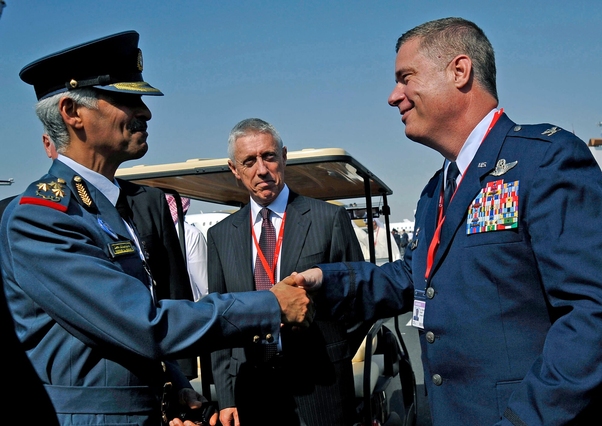Col. Michael Cosby shakes hands with a member of the Bahraini air force during the Bahrain International Airshow Jan. 21, 2010. Colonel Cosby is the Kuwait air force operational advisor. (U.S. Air Force photo/ Staff Sgt. Angelita Lawrence) 