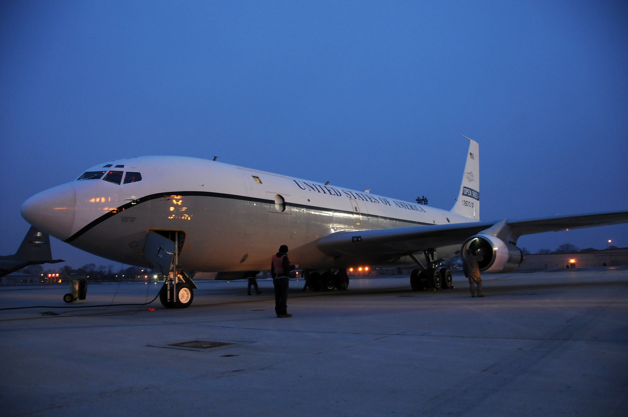The Open Skies OC-135B goes through shutdown and inspection procedures at Wright-Patterson Air Force Base on Jan. 16. The crew was returning to the airfield after flying and imaging aerial film of the devastation in Haiti. The mission provides detailed imagery for damage assessment to assist in recovery and relief efforts. (U.S. Air Force photo by Senior Airman Laszlo Babocsi)