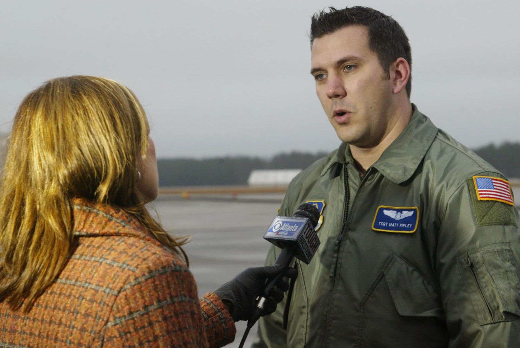During an interview with a CBS 46 reporter, Tech. Sgt. Matthew Ripley from the 700th Airlift Squadron discusses the roles he and his crew played during their support in the Haiti earthquake relief effort. The seven-member aircrew from the 700th Airlift Squadron deployed Jan. 17 and spent their time tranpsorting medical and communications teams to Florida and delivered food, water and fuel to the earthquake victims in Port-au-Prince, Haiti. They returned Jan. 21. (U.S. Air Force photo/Don Peek)