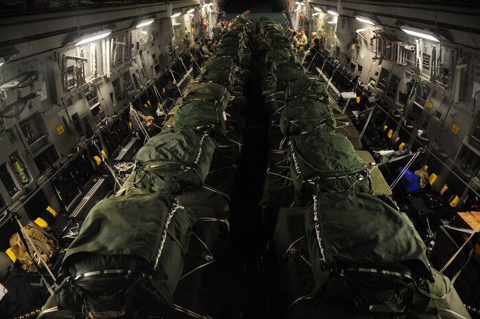 A C-17 Globemaster III  from the 437th Airlift Wing, Charleston Air Force Base, S.C., is loaded with 40 container delivery system bundles totaling 67,800 pounds of Meals Ready to Eat and bottled water before an air delivery mission departing Pope AFB, N.C., in support of Operation Unified Response Jan. 21, 2010. Pope AFB acted as a staging point for the Charleston AFB C-17 aircrew as they carried out the air delivery mission. (U.S. Air Force photo by Staff Sgt. Jacob N. Bailey / Released)