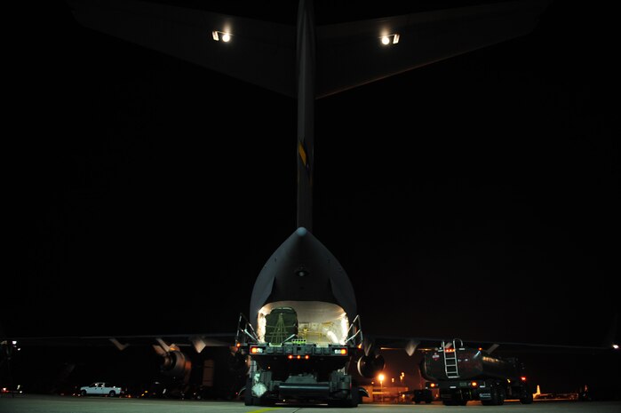 U.S. Air Force Airmen assigned to the 43rd Logistical Readiness Squadron, Pope Air Force Base, N.C., load a C-17 Globemaster III  from the 437th Airlift Wing, Charleston Air Force Base, S.C., before an air delivery mission in support of Operation Unified Response Jan. 21, 2010. Pope AFB acted as a staging point for the Charleston AFB C-17 aircrew as they carried out the air delivery mission. (U.S. Air Force photo by Staff Sgt. Jacob N. Bailey/Released)