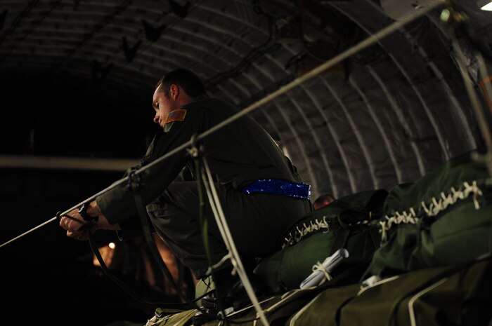 U.S. Air Force Staff Sgt. Richard Miner, a loadmaster assigned to the 43rd Operational Support Squadron, Pope Air Force Base, N.C., conducts a joint inspection aboard a C-17 Globemaster III from the 437th Airlift Wing, Charleston Air Force Base, S.C., before an air delivery mission in support of Operation Unified Response Jan. 21, 2010. The aircrew delivered 40 container delivery system bundles totaling 67,800 pounds of Meals Ready to Eat and bottled water. (U.S. Air Force photo by Staff Sgt. Jacob N. Bailey / Released)