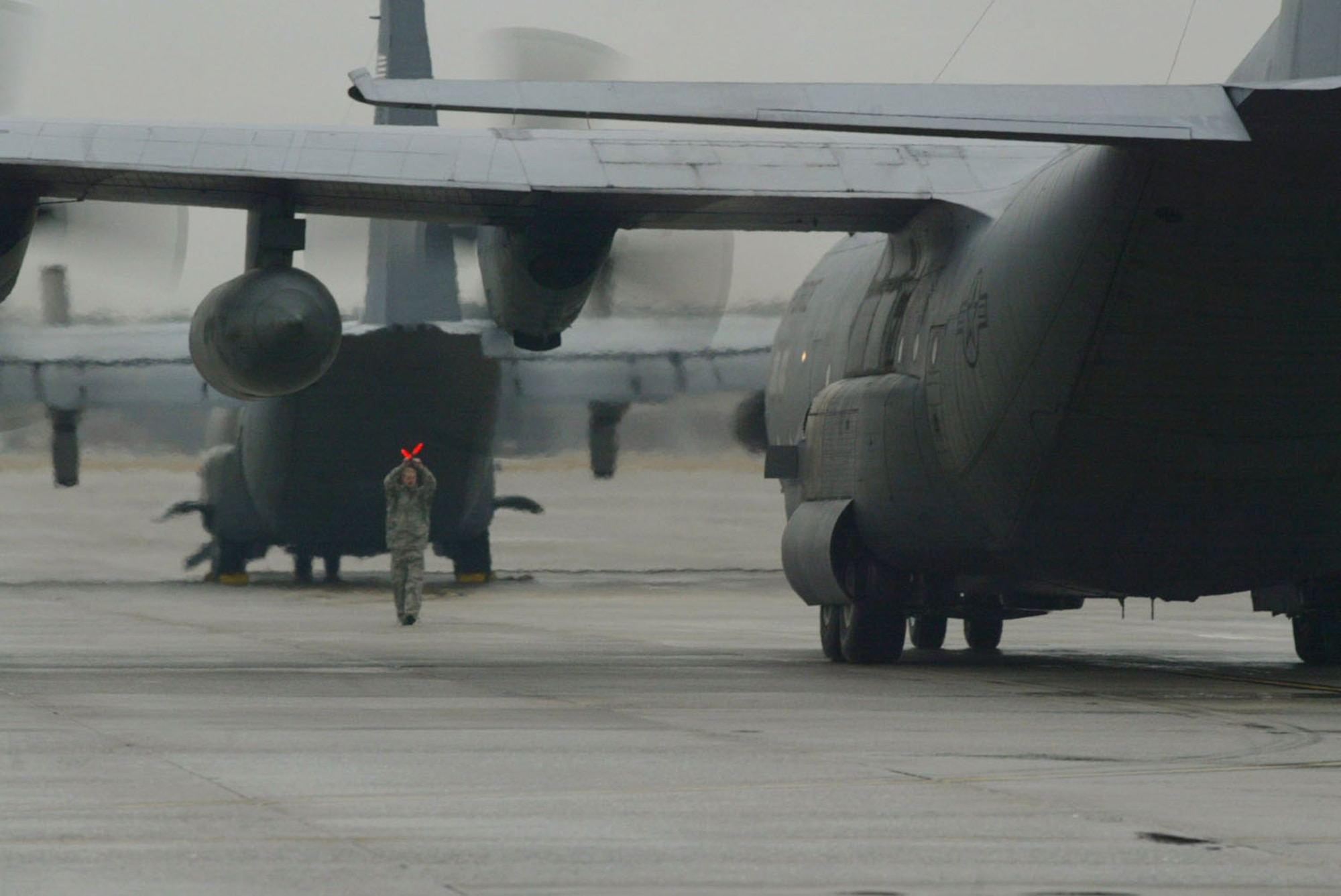 The C-130 aircraft carrying the aircrew that deployed to assist the Haiti earthquake relief efforts safely taxis back to Dobbins Air Reserve Base Jan. 22. The seven-member aircrew from the 700th Airlift Squadron deployed Jan. 17 and spent their time tranpsorting medical and communications teams to Florida and delivered food, water and fuel to the earthquake victims in Port-au-Prince, Haiti. (U.S. Air Force photo/Don Peek)