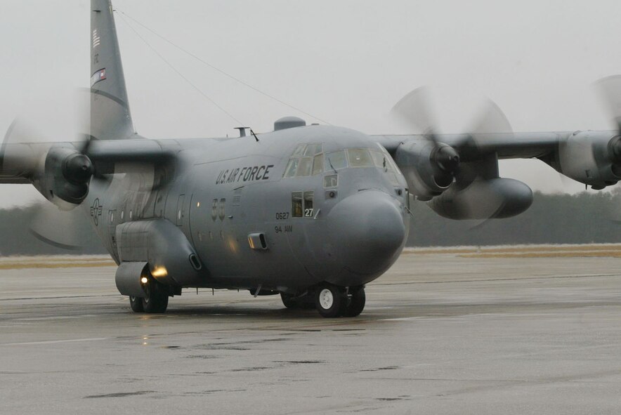 The C-130 aircraft carrying the aircrew that deployed to assist the Haiti earthquake relief efforts safely taxis back to Dobbins Air Reserve Base Jan. 22. The seven-member aircrew from the 700th Airlift Squadron deployed Jan. 17 and spent their time tranpsorting medical and communications teams to Florida and delivered food, water and fuel to the earthquake victims in Port-au-Prince, Haiti. (U.S. Air Force photo/Don Peek)