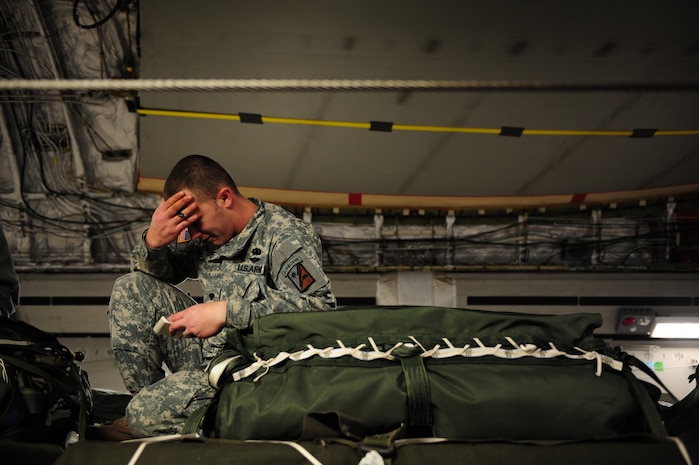 U.S. Army Spc. Daniel Rocco, 11th Quartermaster, 189th Combat Sustainment Support Brigade, Fort Bragg, N.C., reviews the load plan of a C-17 Globemaster III aircraft from the 437th Airlift Wing, Charleston Air Force Base, S.C., before an air delivery mission in support of Operation Unified Response Jan. 21, 2010. The aircrew, assigned to the 15th Airlift Squadron, Charleston AFB, S.C.,  delivered 40 container delivery system bundles totaling 67,800 pounds of Meals Ready to Eat and bottled water. (U.S. Air Force photo by Staff Sgt. Jacob N. Bailey / Released)