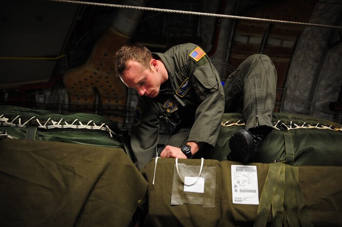U.S. Air Force Staff Sgt. Richard Miner, a loadmaster assigned to the 43rd Operational Support Squadron, Pope Air Force Base, N.C., conducts a joint inspection aboard a C-17 Globemaster III from the 437th Airlift Wing, Charleston Air Force Base, S.C., before an air delivery mission in support of Operation Unified Response Jan. 21, 2010. The aircrew delivered 40 container delivery system bundles totaling 67,800 pounds of Meals Ready to Eat and bottled water. (U.S. Air Force photo by Staff Sgt. Jacob N. Bailey / Released)