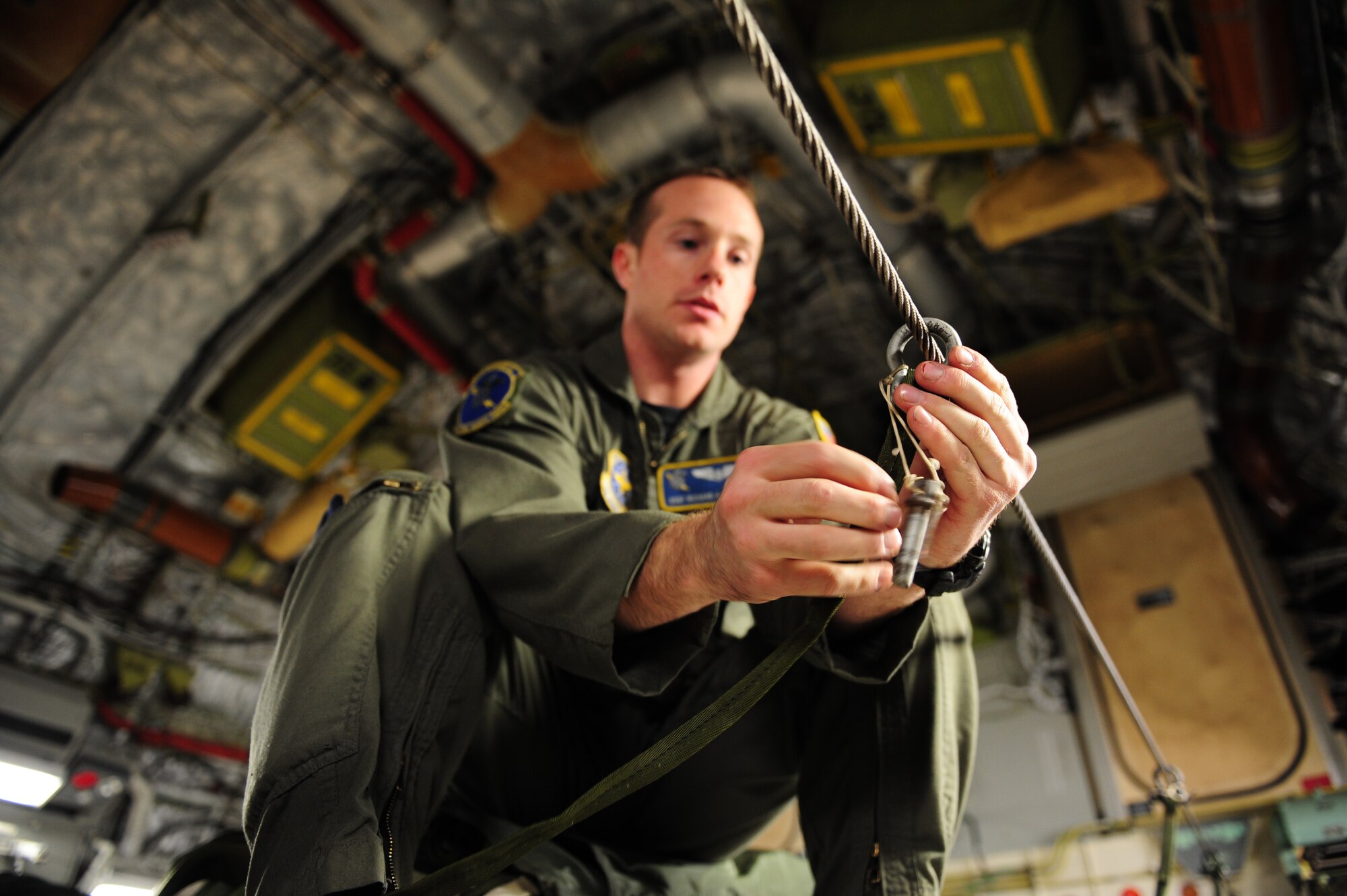 U.S. Air Force Staff Sgt. Richard Miner, a loadmaster assigned to the 43rd Operational Support Squadron, Pope Air Force Base, N.C., conducts a joint inspection aboard a C-17 Globemaster III from the 437th Airlift Wing, Charleston Air Force Base, S.C., before an air delivery mission in support of Operation Unified Response Jan. 21, 2010. The aircrew delivered 40 container delivery system bundles totaling 67,800 pounds of Meals Ready to Eat and bottled water. (U.S. Air Force photo by Staff Sgt. Jacob N. Bailey / Released)