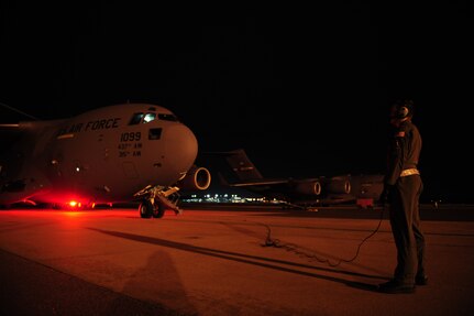 U.S. Air Force 1st Lt. David Redwine, a C-17 Globemaster III pilot assigned to the 15th Airlift Squadron, Charleston Air Force Base, S.C., monitors aircraft engines startup before launching on an air delivery mission from Charleston AFB in support of Operation Unified Response Jan. 20, 2010. The mission was the second air delivery flown to Haiti since relief operations began. (U.S. Air Force photo by Staff Sgt. Jacob N. Bailey / Released)