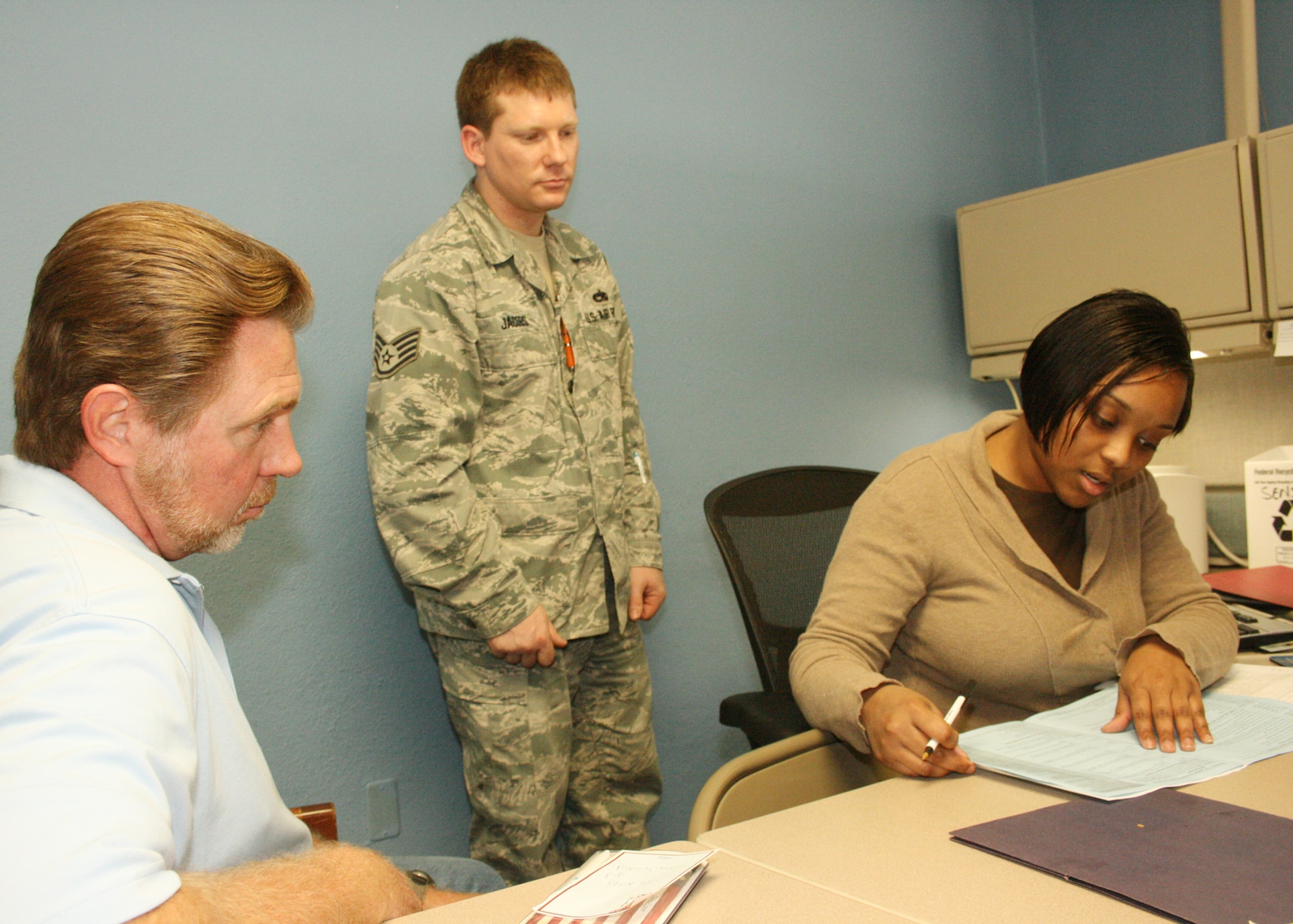 EGLIN AIR FORCE BASE, Fla. - Volunteers at the Eglin tax center help military, dependent, retired, and DoD civilian customers prepare and file their federal and state tax returns. Located across 2nd street from the base education center, the tax center is open Monday through Friday from 8 to 11 a.m. and 12:30 to 3:30 p.m. Wednesday is reserved for 1040EZ filing members. For all other times, call 882-1040 to make an appointment. (U.S. Air Force photos by 2nd Lt. Andrew Caulk)