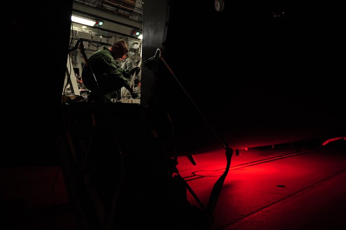 U.S. Air Force Staff Sgt. Matthew Shields, a C-17 Globemaster III loadmaster assigned to the 15th Airlift Squadron, Charleston Air Force Base, S.C., prepares an aircraft configuration before an air delivery mission in support of Operation Unified Response at Charleston AFB, S.C., Jan. 20, 2010. The mission was the second air delivery flown to Haiti since relief operations began. (U.S. Air Force photo by Staff Sgt. Jacob N. Bailey / Released)